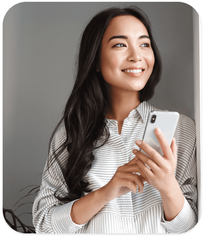 Smiling patient holding a phone